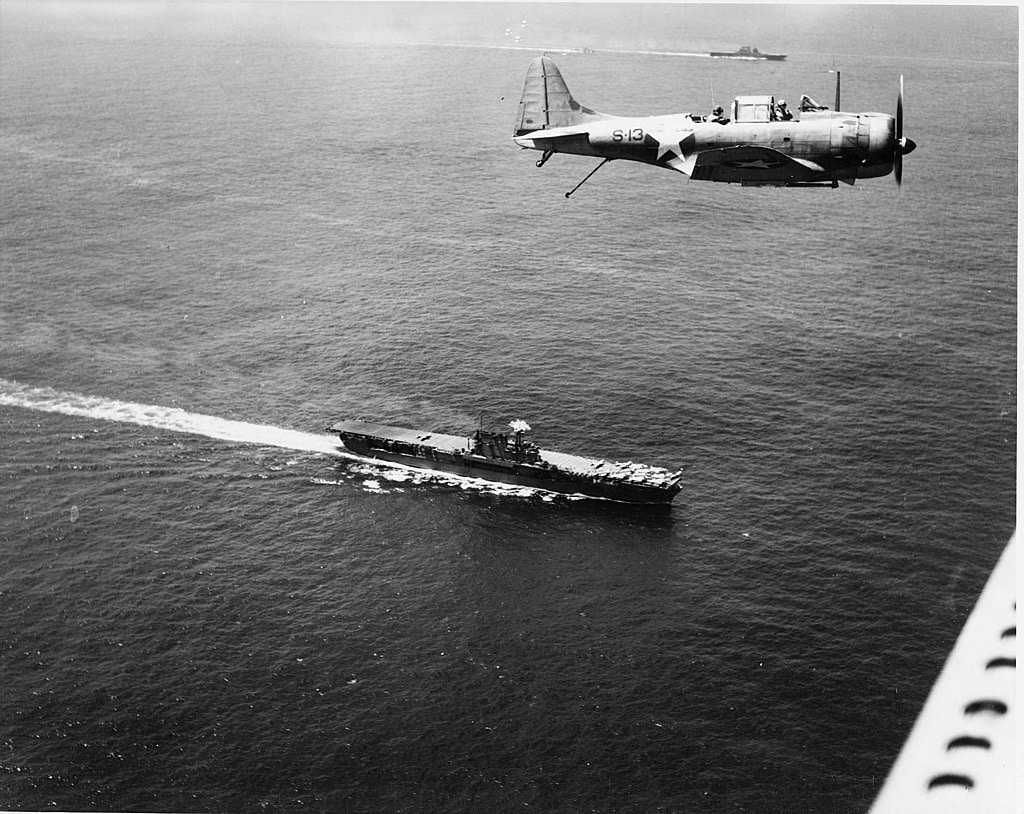 Douglas_SBD_flies_over_USS_Enterprise_(CV-6)_and_USS_Saratoga_(CV-3)_on_19_December_1942